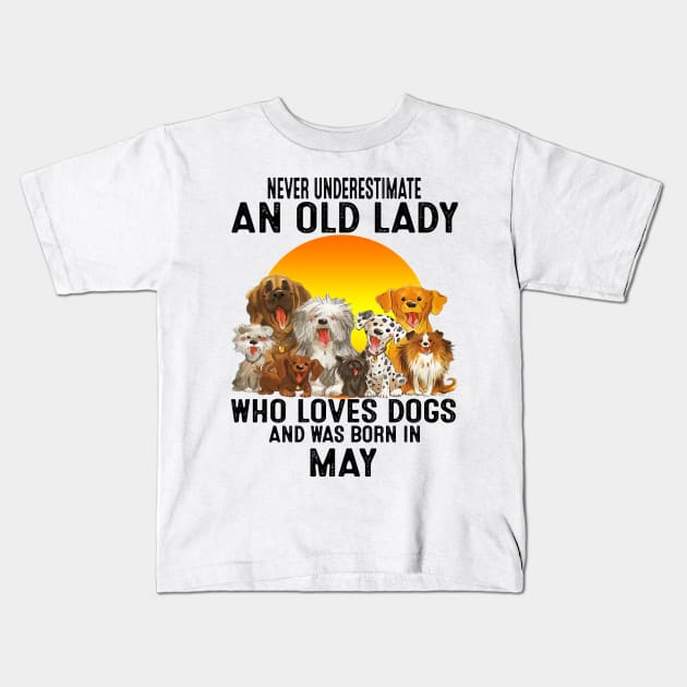 Never Underestimate An Old May Lady Who Loves Dogs Kids T-Shirt by trainerunderline